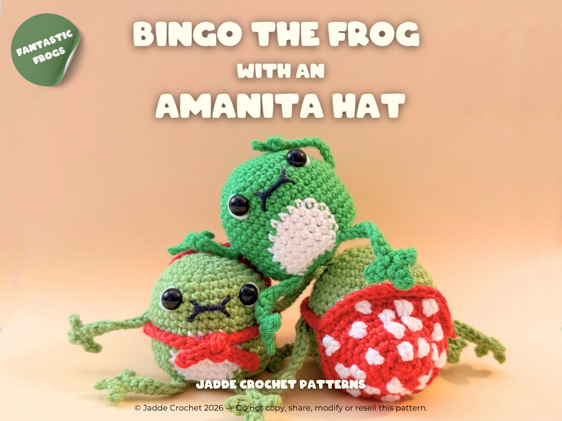 Two green crochet frogs with an Amanita hat on a beige background, featuring 'Fantastic Frogs' branding.